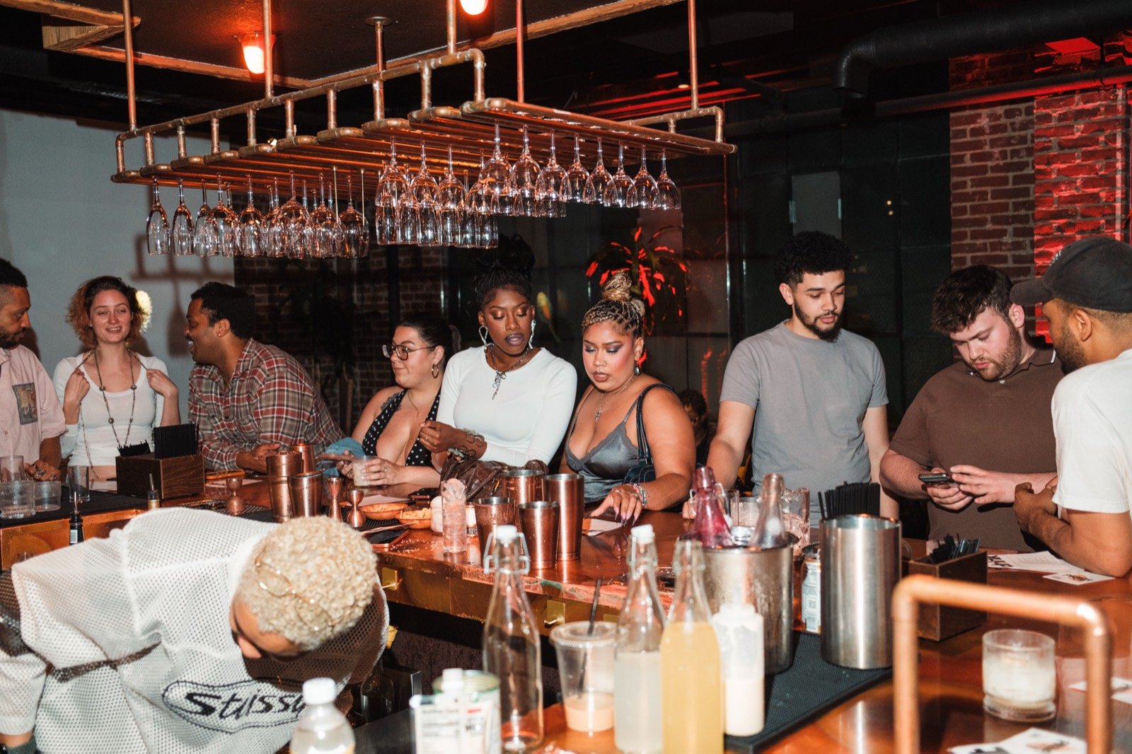 Guests gathered along the bar during Part of Me vol. 1